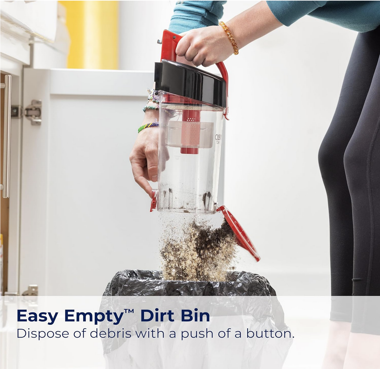 BISSELL CleanView Compact Upright Vacuum standing with cleaning attachments